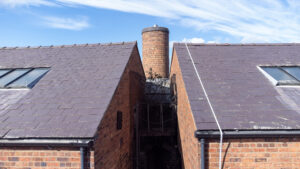 A brick building with a chimney.